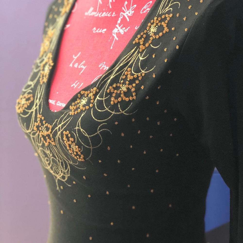 Black and gold, delicately detailed blouse.